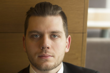 Obraz premium portrait of a successful businessman on background of office