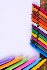 Fototapeta premium various stationery items on a wooden background with space for text top view 