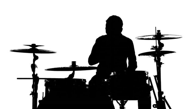 Silhouette of the drummer and drums