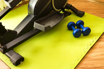 equipment for domestic (home) workouts: elliptical trainer, dumbbells