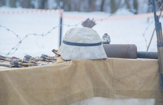close-up, German helmet and a belt-fed weapon world war II.