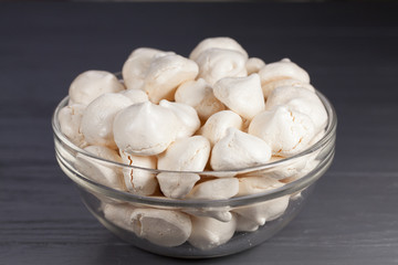 White mini meringue in transparent vase