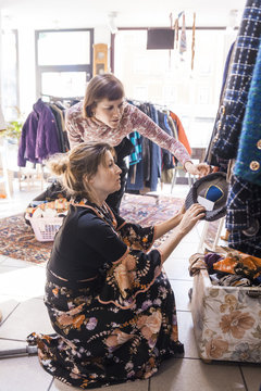 Two women in a second hand shop