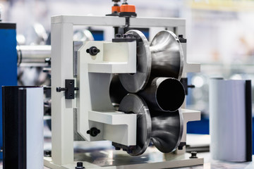 Fototapeta na wymiar Machine for production of downspout tubes