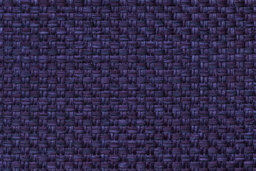 Navy blue textile background with checkered pattern, closeup. Structure of the fabric macro.