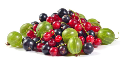 Heap of various kinds of fresh berries on a white