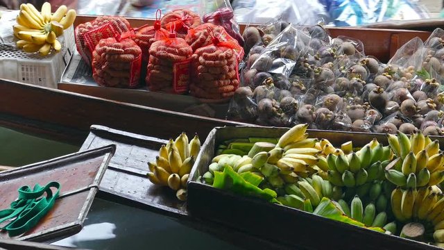 Boat with fruits and vegetables on floating market Damnoen Saduak in Bangkok, Thailand
