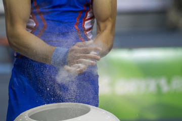 gymnast prepares hands