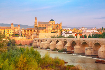Great Mosque Mezquita - Catedral de Cordoba and Roman bridge across Guadalquivir river in the...