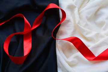 red ribbon on a background of contrasting colour