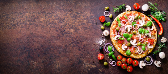 Food ingredients and spices for cooking delicious italian pizza. Mushrooms, tomatoes, cheese, onion, oil, pepper, salt, basil, olive on rustic background. Copyspace. Top view. Banner.