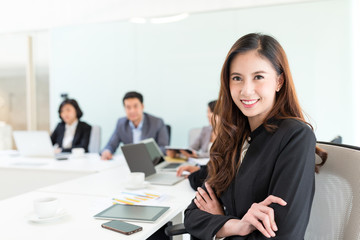 Businesswoman in meeting room during presentation