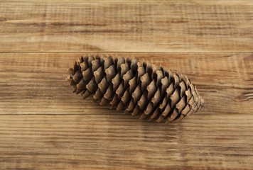 pine cone on a wooden background