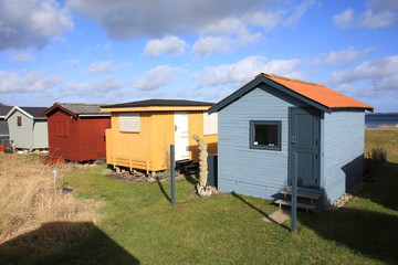 Fototapeta na wymiar Beach huts on the coast in Kerteminde, Fyn Island, Denmark