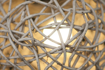 The light is illuminated in the lamps made of bamboo weave together.
