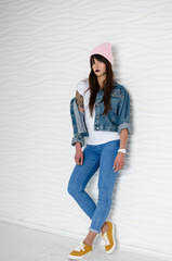 Young sexy woman in pink fashionable hat
