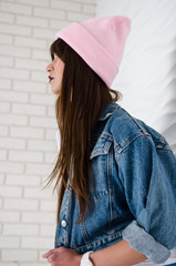 Young sexy woman in pink fashionable hat