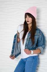 Young sexy woman in pink fashionable hat