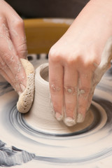 Artist working with Pottery
