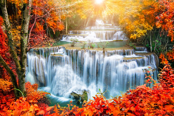 Beautiful waterfall in autumn forest  
