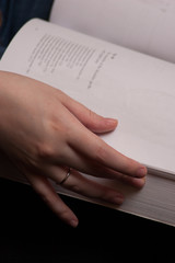 Person Holding Book While Reading