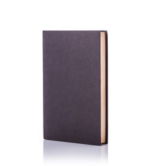 Old book with empty blank cover. Studio shot isolated on white