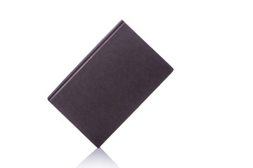 Old book with empty blank cover. Studio shot isolated on white