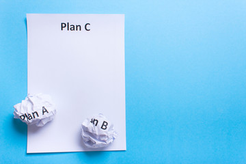 Crumpled paper Plan A B and clean sheet Plan C