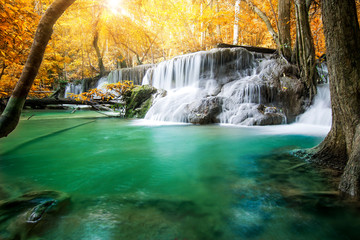 Beautiful waterfall in autumn forest  