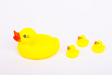 Yellow bath duck toy with little ducks