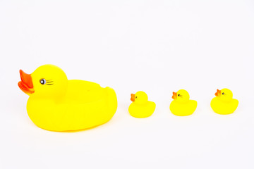 Yellow bath duck toy with little ducks