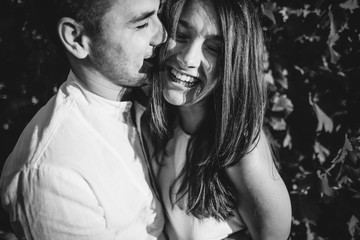 Fototapeta premium Young couple kissing in Tuscany vineyards, Italy