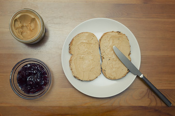 Peanut Butter, Cherry Jam And Bread Slices For Breakfast