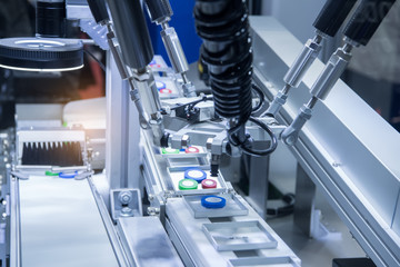 Automatic robot in assembly line working in factory. Smart factory industry 4.0 concept.