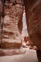 Siq narrow long ravine and main entrance to ancient nabatean city of Petra in Jordan, Middle East 