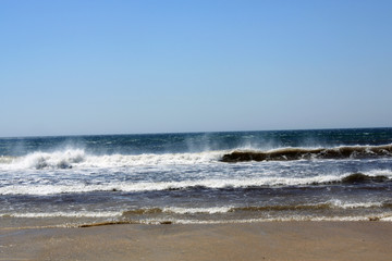 Waves crashing onto beach