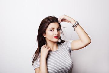 Fototapeta premium Young attractive woman with long black hair on white background.