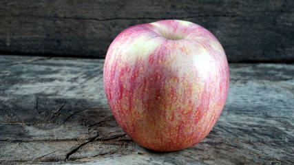 Apple on the wood table.