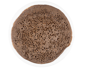 Traditional Ethiopean flatbread from fermented teff flour on a white plate