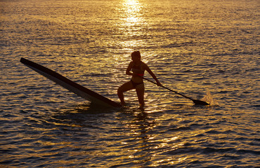 SUP Stand up Surf girl with paddle