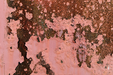 Background of Rusty metal and pink paint.