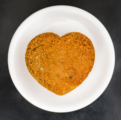Homemade muffins heart shaped on white plate