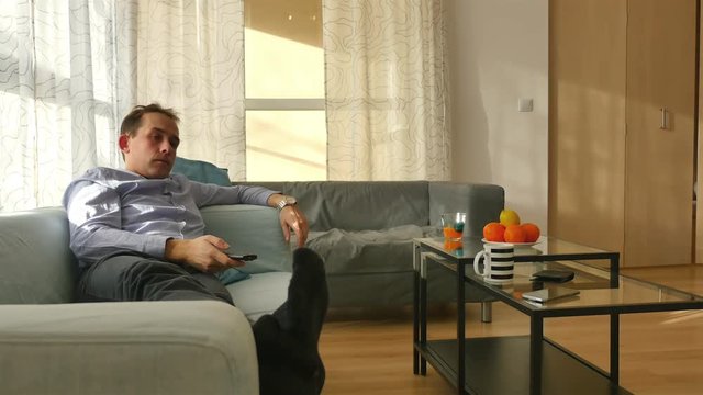 High quality video of man watching tv in 4K