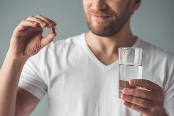 Handsome man with medicine