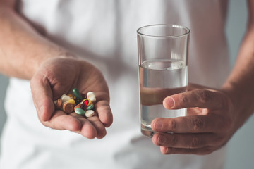 Handsome man with medicine