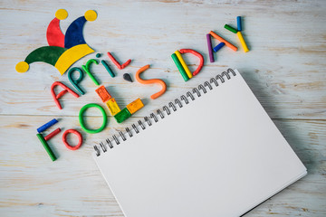 April Fools' Day text made with plasticine and free space in note