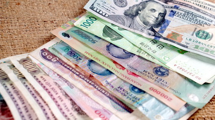 US dollars, Korean Won, Euro bills and some money bills and banknotes. Currency foreign exchange. Business and Financial or money management for investments.