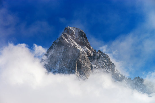 Clouds around the peak of beautiful rock