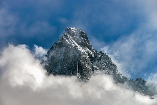 Clouds around the peak of beautiful rock