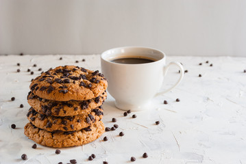 Homemade chocolate chip cookies and coffee. Chocolate crumbs.